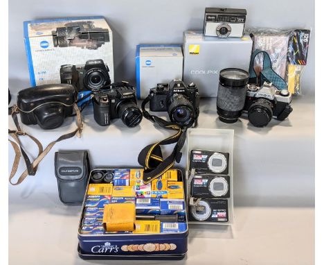 A box containing various camera equipment (see attached list) including Minolta lenses and cases, Nikon lenses, etc (11 piece