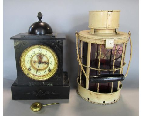A Victorian black slate mantel clock, the eight day movement with visible escapement, (pendulum) together with a brass and ti