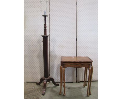 An adjustable lamp standard on a hexagonal column and tripod base together with two graduated occasional tables 