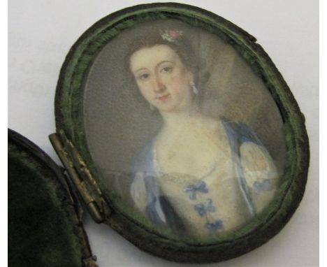 18th century British school - Fine quality half length miniature portrait of a lady in blue and white dress, with flowers in 