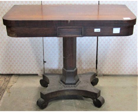 A 19th century rosewood veneered foldover top card table of rectangular form with rounded front corners and applied split  be