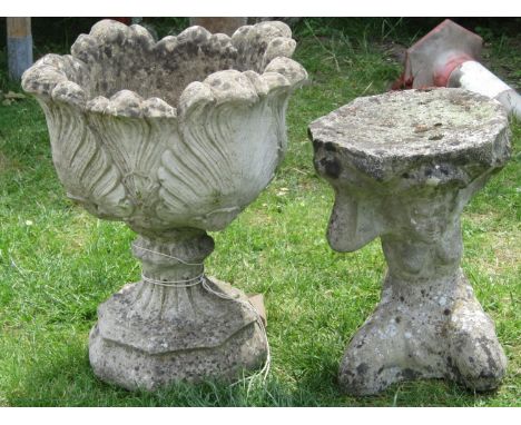 A reclaimed garden urn with acanthus leaf bowl and foliate socle with foliate octagonal base, together with a bird bath in th