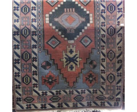 Turkish Caucasian type rug with green and orange central medallions upon a light ground, 240 x 150 cm 