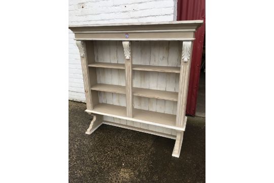 A Painted Wall Dresser With Moulded Cornice Above Open Shelves