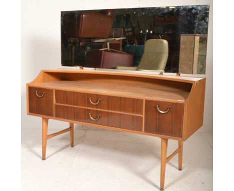 A good vintage retro 20th Century G-Plan light oak dressing table raised on tapering supports with two central drawers flanke