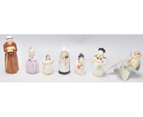 A group of six Royal Worcester porcelain candle snuffers to include a monk, a nun, a Chinese figure, a seated Geisha, a histo