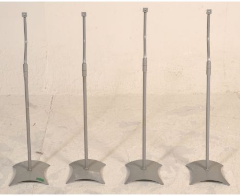 A matching set of four surround sound speaker stands finished in grey raised on curved shaped supports. Measures 80 cm high&n