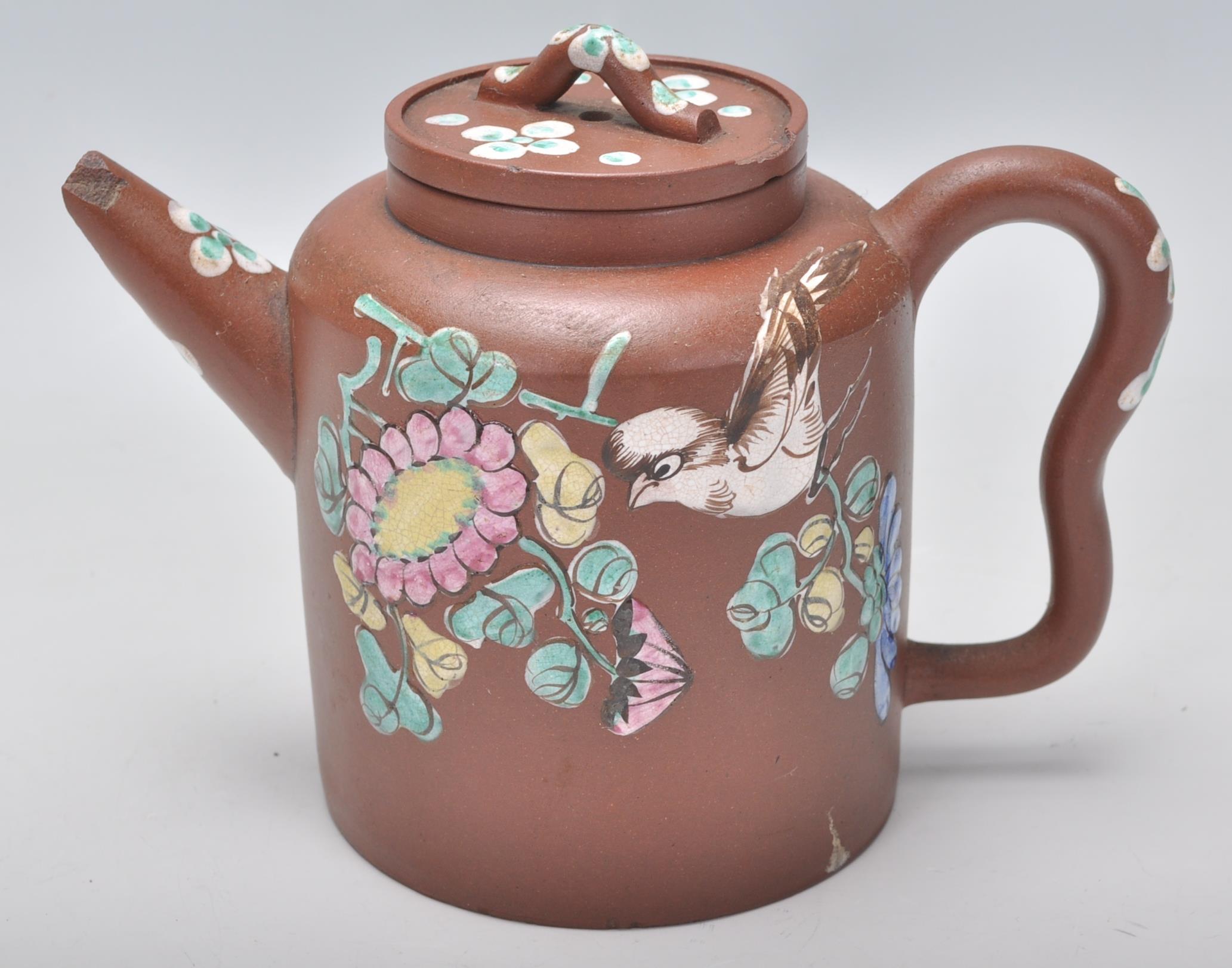 An early 20th Century Chinese brown clay teapot having hand enameled