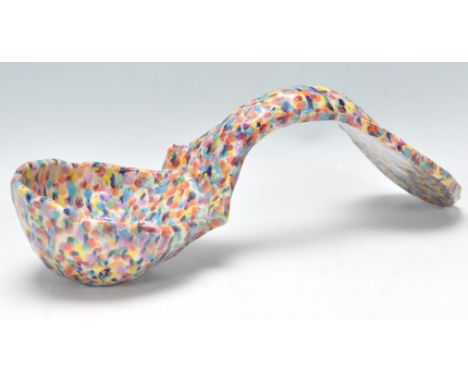A 20th Century folk art large ladle with hand painted with multiple colours. Measures 39cm long.&nbsp;