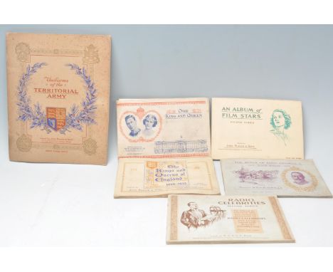 A collection of vintage cigarette card picture books all being complete to include Wills; Our King and Queen, An Album of Fil