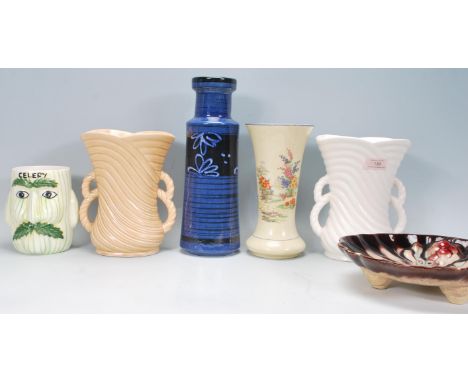 A collection of early 20th Century vintage pottery to include two Sylvac vases of reeded form having twin rope twist handles,