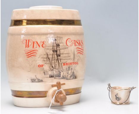 A good early 20th Century ceramic barrel by Crown Devon for 'Wine Casks Of Bristol' having printed ship to the front with gil