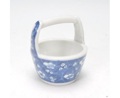 An early 20th Century Chinese prunus pattern ceramic water pail / bucket of typical form. Measures 8cm tall by 8cm wide.&nbsp