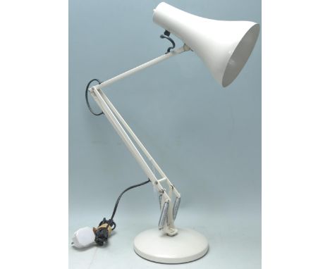 A vintage retro 20th Century anglepoise desk lamp in the manor of Herbert Terry raised on a white round base with pendant lig