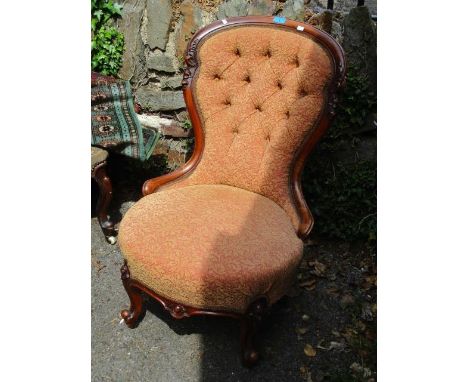 A Victorian walnut spoon and button back nursing chair 
