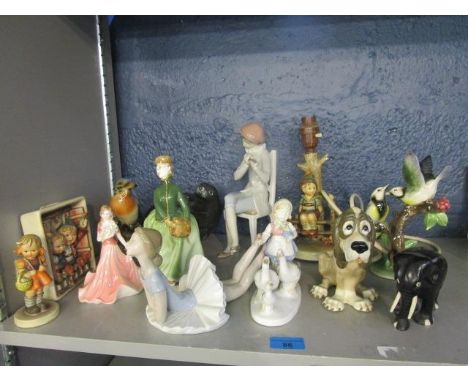 A mixed group of ornaments to include Lladro figurines, a Hummel figural table group, Royal Doulton figurines and other items