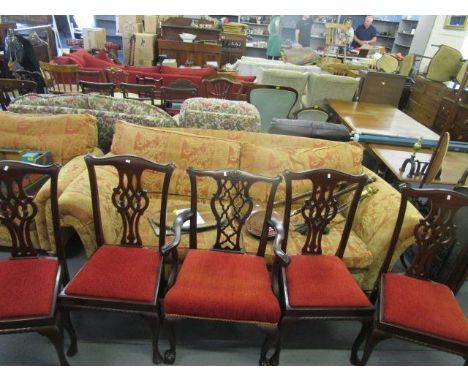 A set of four Chippendale style mahogany dining chairs with pierced central splats, upholstered drop in sets on cabriole legs