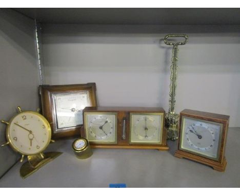 An Elliott oak cased mantel clock, temperature and barometer combination, the clock dial marked with retailer's name Sorley G