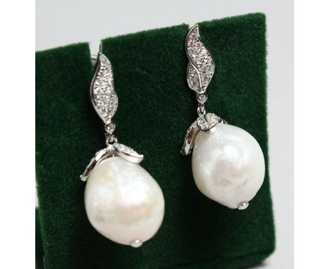 A PAIR OF SILVER BAROQUE PEARL EARRINGS.