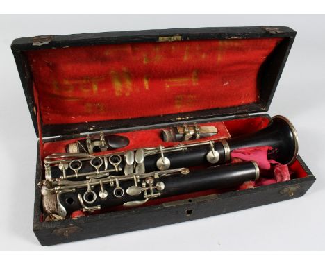 A CLARINET in a folding leather case.
