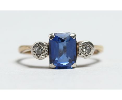 AN 18CT GOLD SAPPHIRE AND DIAMOND RING.