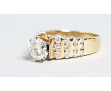 A SUPERB 14CT GOLD DIAMOND RING with four row diamond shoulders.