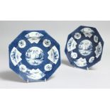 A PAIR OF WORCESTER POWDER BLUE OCTAGONAL PLATES with Chinese vignettes. 6.75ins diameter.