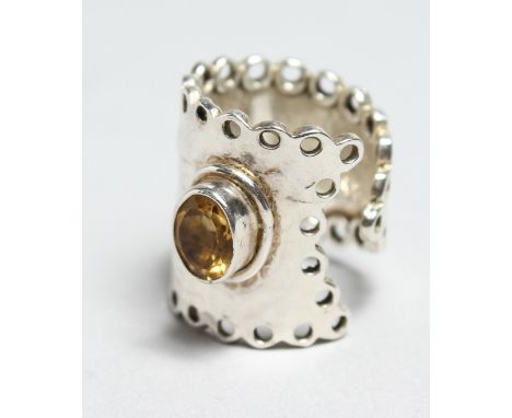 A CHUNKY SILVER CITRINE RING.