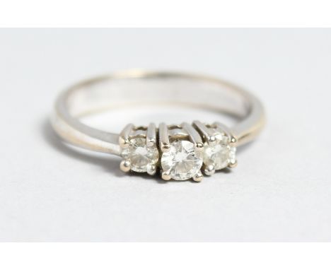 AN 18CT WHITE GOLD THREE STONE DIAMOND RING