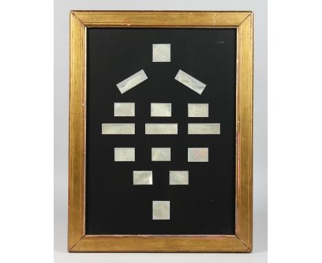 FIFTEEN DECORATED MOTHER OF PEARL COUNTERS in a glazed gilt frame. 16ins x 11ins.