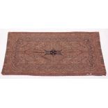A KASHMIRI SHAWL woven in reds, creams and black to a Paisley design. 7ft x 3ft 4ins.