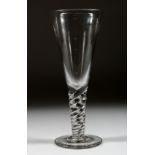 A LARGE PLAIN GLASS TAPERING GLASS with twisted stem. 11ins high.