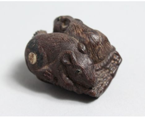 A CARVED WOOD NETSUKE OF TWO RATS