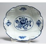 AN 18TH CENTRUY BOW BASKET WEAVE MOULDED DISH painted with flowers in underglaze blue.