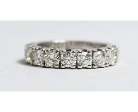 A VERY GOOD 18CT WHITE GOLD 4.20CT DIAMOND ETERNITY RING.