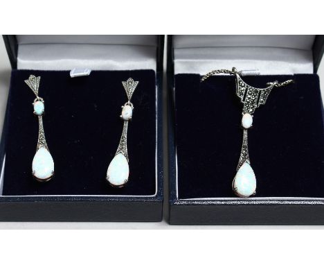 A SILVER ART DECO DESIGN OPAL AND MARCASITE PENDANT, CHAIN AND EARRINGS.