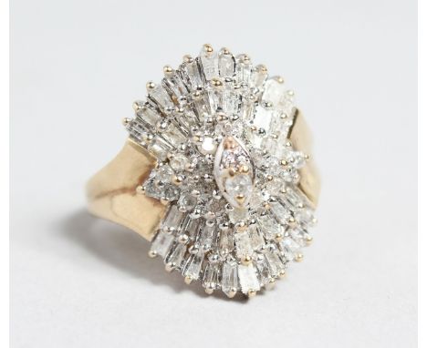 A 10CT GOLD BAGUETTE AND DIAMOND CLUSTER RING.