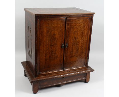 A SUPERB ITALIAN POKER WORK CABINET with double panel doors opening to reveal a fitted interior with  drawers.