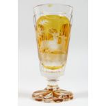 A GOOD BOHEMIAN AMBER GOBLET engraved with panels of deer. 6ins high.
