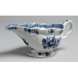 AN 18TH CENTURY BOW SAUCE BOAT painted with a large rose and other flowers with an inner cell