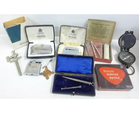 A WWI period compass, three Ronson lighters and two service outfit tins, pipe reamer, silver pencil, etc. 