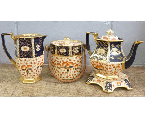 A c.1900 Imari pattern teapot, water jug and biscuit barrel 