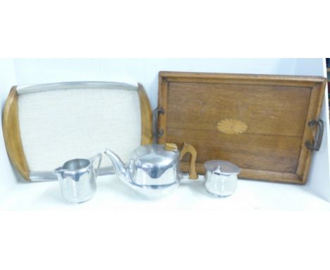 A Picquot ware three piece tea service and tray and one other Edwardian inlaid tray 