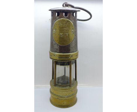 An Ackroyd &amp; Best miner's safety lamp 