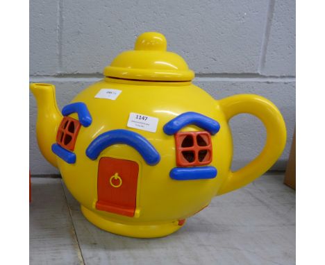 A 1980's Blue Bird big yellow teapot and figures **PLEASE NOTE THIS LOT IS NOT ELIGIBLE FOR POSTING AND PACKING** 