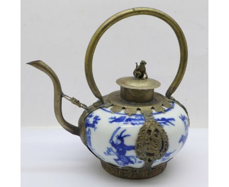 A small Chinese blue and white metal framed teapot 