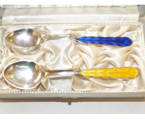 Cased pair of Finnish silver and enamel spoons, inscribed 'SUOMI-SCOTLAND 27.5.65'