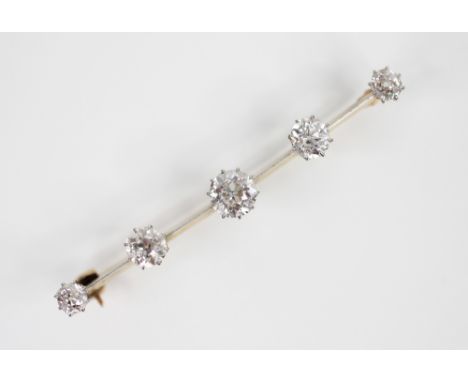 A diamond five stone brooch, the central old cut diamond weighing approximately 1 carat, with a further two diamonds to eithe