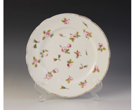 A Welsh Nantgarw porcelain plate, early 19th century, extensively decorated with polychrome enamel rose blooms, the shaped ri