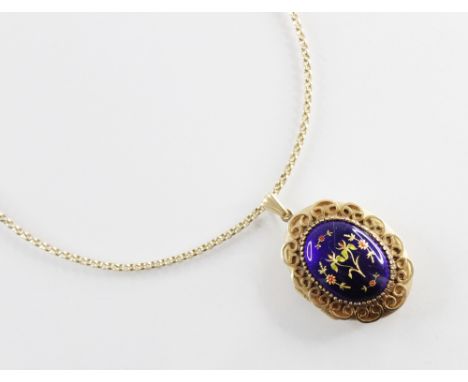 An enamelled 9ct gold locket pendant, of oval form, the central panel decorated with blue enamel and gilded flowers within a 